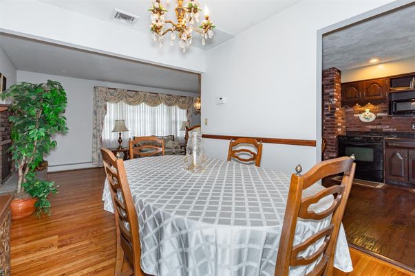 Chandelier, Dining room, Fireplace, Interior, Kitchen, Recessed Lighting, Wood Texture Flooring