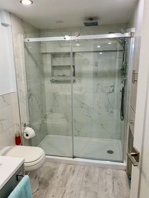 Bathroom, Glass Shower, Interior, Marble Walls, Recessed Lighting, Wood Texture Flooring
