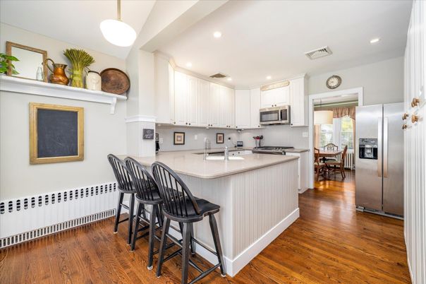 Dining room, Interior, Kitchen, Pendant Lights, Recessed Lighting, Stainless Steel Appliances, Wood Texture Flooring