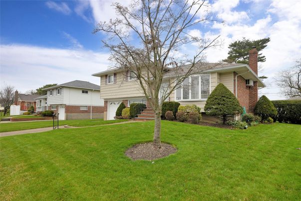 Attached, Backyard, Exterior, Facade, Brick Facade, Split Level