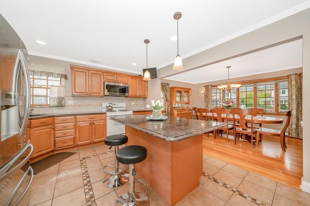 Chandelier, Dining room, Interior, Kitchen, Pendant Lights, Recessed Lighting, Stainless Steel Appliances, Wood Texture Flooring