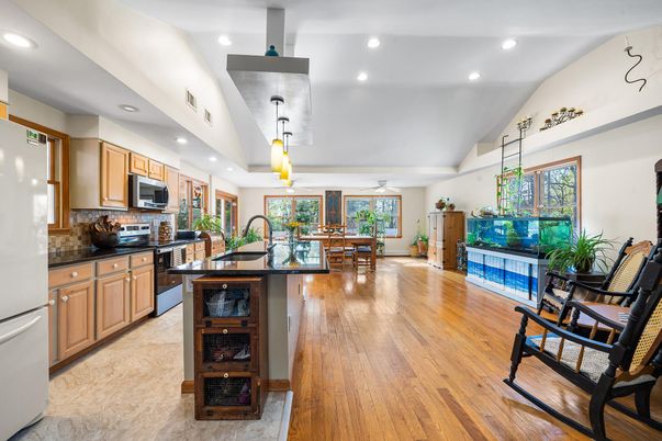 Dining room, Interior, Kitchen, Pendant Lights, Recessed Lighting, Stainless Steel Appliances, Wood Texture Flooring
