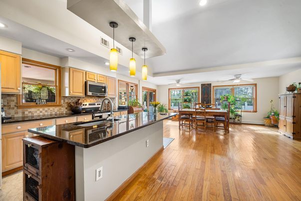 Dining room, Interior, Kitchen, Pendant Lights, Recessed Lighting, Stainless Steel Appliances, Wood Texture Flooring