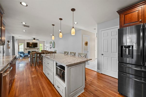 Dining room, Interior, Kitchen, Pendant Lights, Recessed Lighting, Stainless Steel Appliances, Wood Texture Flooring