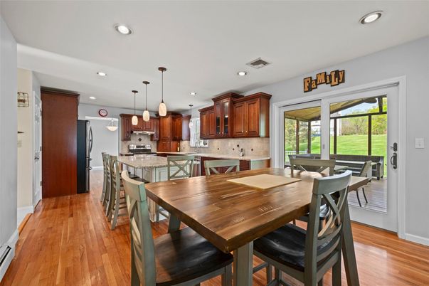 Dining room, Interior, Kitchen, Pendant Lights, Recessed Lighting, Stainless Steel Appliances, Wood Texture Flooring