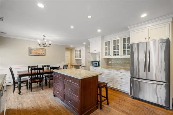 Chandelier, Dining room, Interior, Kitchen, Recessed Lighting, Stainless Steel Appliances, Wood Texture Flooring