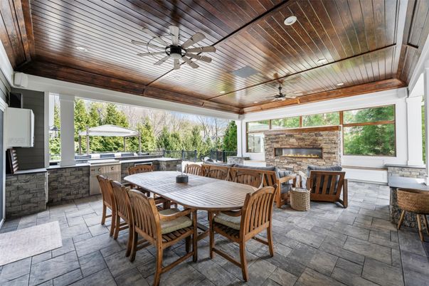 Dining room, Fireplace, Interior, Living room, Recessed Lighting, Stone Walls, Wooden Ceilings