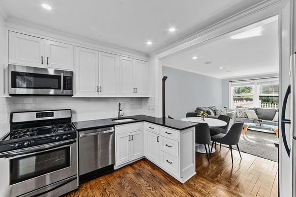 Dining room, Interior, Kitchen, Living room, Recessed Lighting, Stainless Steel Appliances, Wood Texture Flooring