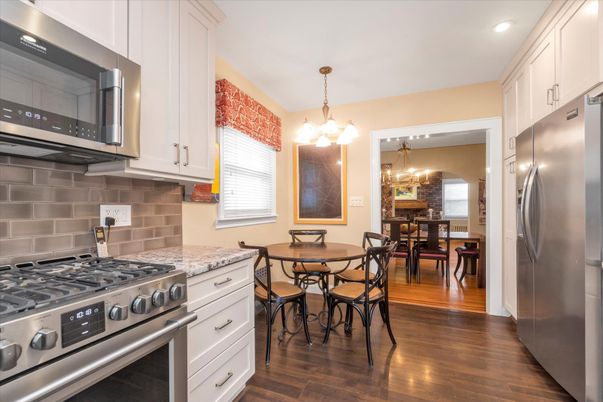 Chandelier, Dining room, Interior, Kitchen, Pendant Lights, Recessed Lighting, Stainless Steel Appliances, Wood Texture Flooring
