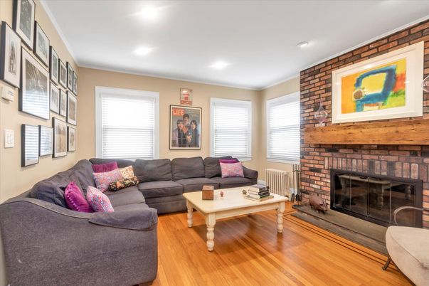 Fireplace, Interior, Living room, Recessed Lighting, Stone Walls, Wood Texture Flooring