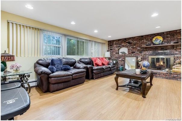 Fireplace, Interior, Living room, Recessed Lighting, Stone Walls, Wood Texture Flooring