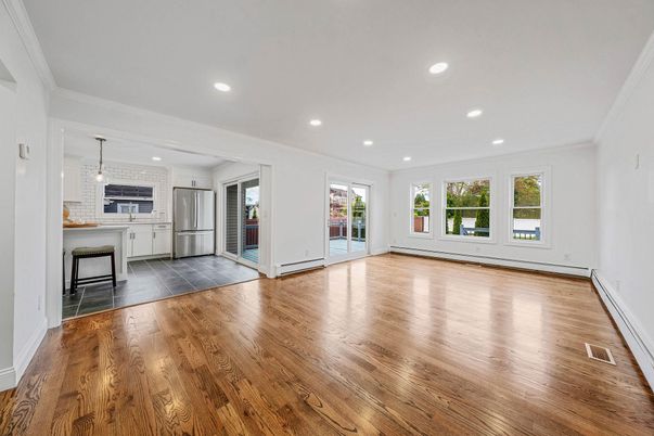 Empty room, Interior, Kitchen, Pendant Lights, Recessed Lighting, Stainless Steel Appliances, Wood Texture Flooring