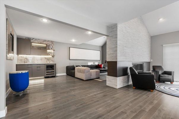Fireplace, Interior, Living room, Recessed Lighting, Stone Walls, Wood Texture Flooring