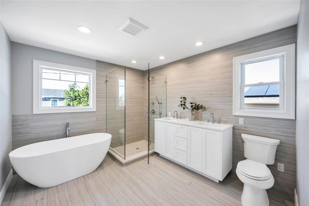 Bathroom, Dual Sink Vanities, Free Standing Baths, Glass Shower, Interior, Recessed Lighting, Wood Texture Flooring