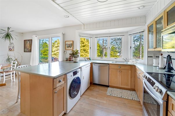 Interior, Kitchen, Recessed Lighting, Washer, Wood Texture Flooring