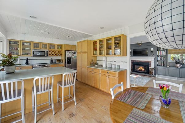 Fireplace, Interior, Kitchen, Stainless Steel Appliances, Wood Texture Flooring