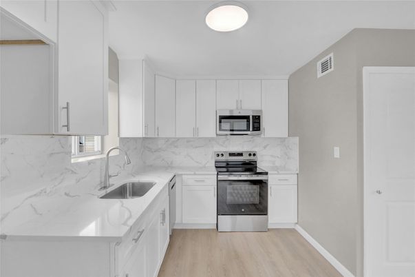 Interior, Kitchen, Marble Walls, Stainless Steel Appliances, Wood Texture Flooring
