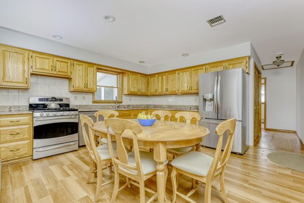 Dining room, Interior, Kitchen, Recessed Lighting, Stainless Steel Appliances, Wood Texture Flooring