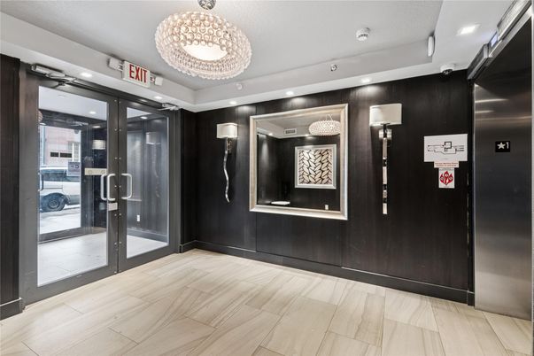 Chandelier, Elevator, Interior, Recessed Lighting, Wood Texture Flooring