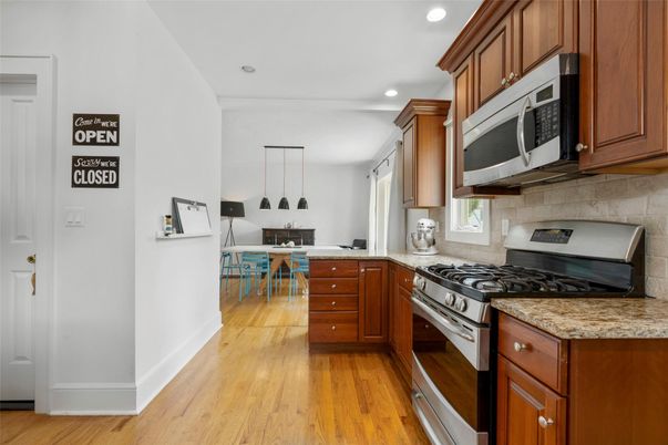 Dining room, Interior, Kitchen, Pendant Lights, Recessed Lighting, Stainless Steel Appliances, Wood Texture Flooring