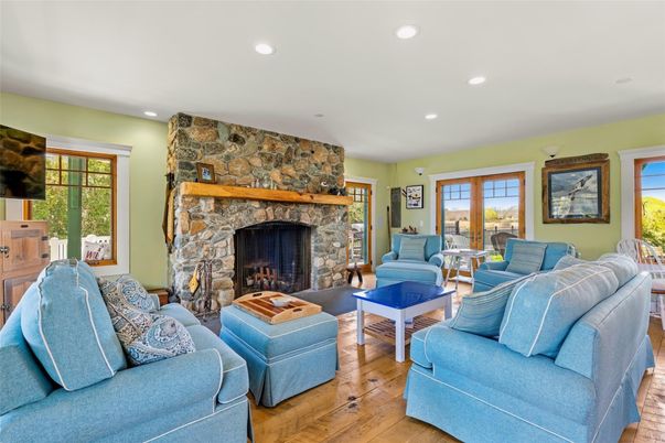 Fireplace, Interior, Living room, Recessed Lighting, Stone Walls, Wood Texture Flooring