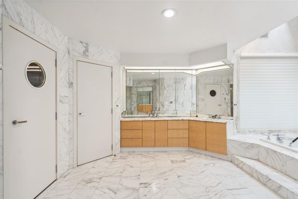 Bathroom, Dual Sink Vanities, Glass Shower, Interior, Marble, Marble Walls, Recessed Lighting