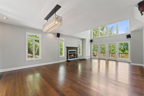 Chandelier, Empty room, Fireplace, Interior, Recessed Lighting, Wood Texture Flooring