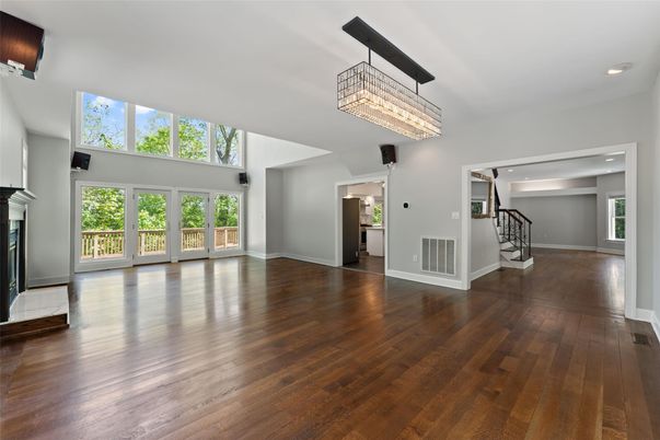 Chandelier, Empty room, Fireplace, Interior, Recessed Lighting, Wood Texture Flooring