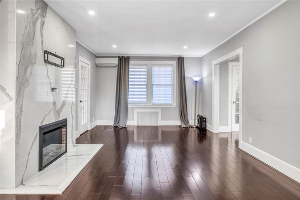 Fireplace, Interior, Marble Walls, Recessed Lighting, Wood Texture Flooring