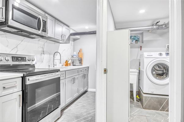 Interior, Kitchen, Marble Walls, Recessed Lighting, Utility Closets, Washer