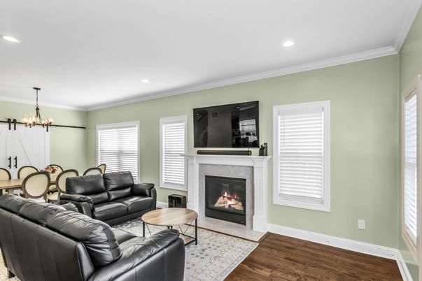 Chandelier, Dining room, Fireplace, Interior, Living room, Recessed Lighting, Wood Texture Flooring