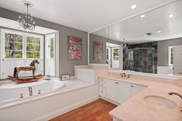 Bathroom, Chandelier, Dual Sink Vanities, Glass Shower, Interior, Recessed Lighting, Wood Texture Flooring