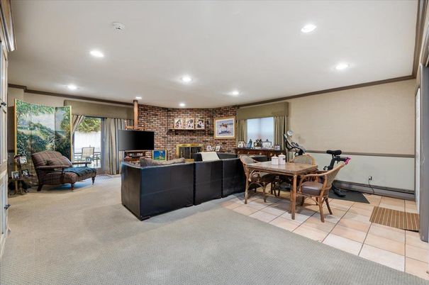 Dining room, Fireplace, Fitness Equipment, Interior, Living room, Recessed Lighting, Stone Walls