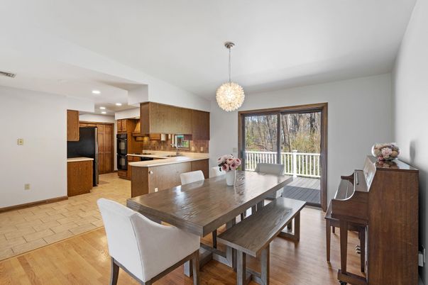 Chandelier, Dining room, Interior, Kitchen, Pendant Lights, Recessed Lighting, Stainless Steel Appliances, Wood Texture Flooring