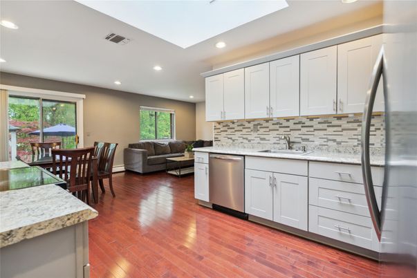 Dining room, Interior, Kitchen, Living room, Recessed Lighting, Stainless Steel Appliances, Wood Texture Flooring