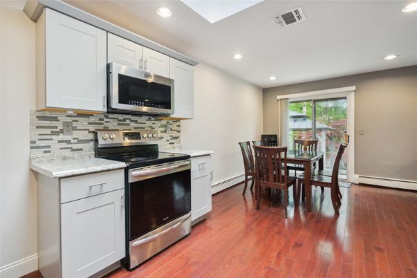 Dining room, Interior, Kitchen, Recessed Lighting, Stainless Steel Appliances, Wood Texture Flooring