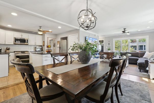 Chandelier, Dining room, Interior, Kitchen, Living room, Pendant Lights, Recessed Lighting, Stainless Steel Appliances, Wood Texture Flooring