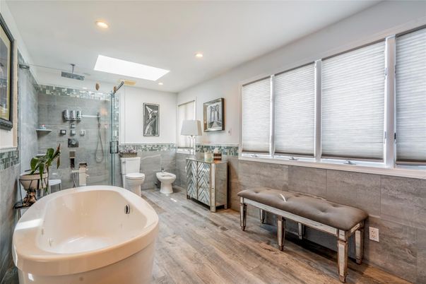 Bathroom, Free Standing Baths, Glass Shower, Interior, Recessed Lighting, Wood Texture Flooring