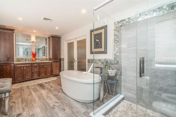 Bathroom, Dual Sink Vanities, Free Standing Baths, Glass Shower, Interior, Recessed Lighting, Wood Texture Flooring