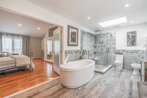 Bathroom, Bedroom, Free Standing Baths, Glass Shower, Interior, Recessed Lighting, Wood Texture Flooring