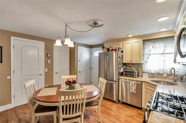 Dining room, Interior, Kitchen, Recessed Lighting, Stainless Steel Appliances, Wood Texture Flooring