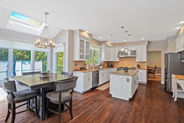 Chandelier, Dining room, Interior, Kitchen, Pendant Lights, Recessed Lighting, Stainless Steel Appliances, Wood Texture Flooring