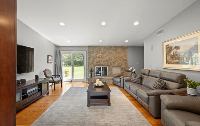 Fireplace, Interior, Living room, Recessed Lighting, Stone Walls, Wood Texture Flooring