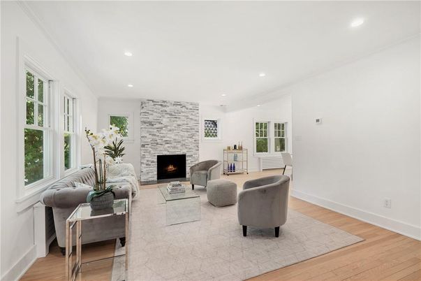 Fireplace, Interior, Living room, Recessed Lighting, Stone Walls, Wood Texture Flooring