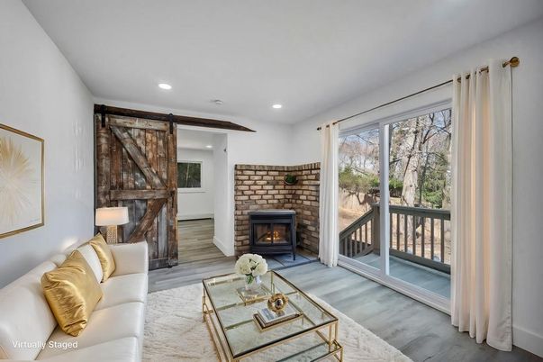 Fireplace, Interior, Living room, Recessed Lighting, Stone Walls, Wood Texture Flooring