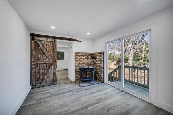 Fireplace, Interior, Recessed Lighting, Stone Walls, Wood Texture Flooring