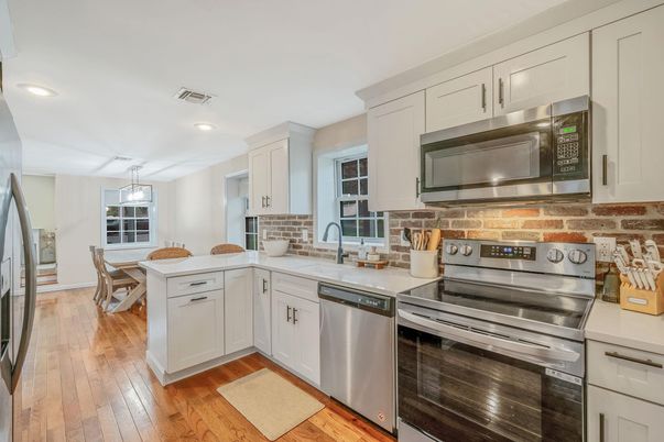 Dining room, Interior, Kitchen, Pendant Lights, Recessed Lighting, Stainless Steel Appliances, Wood Texture Flooring