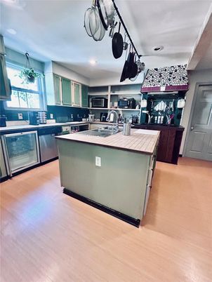 Interior, Kitchen, Recessed Lighting, Tile Countertops, Wood Texture Flooring