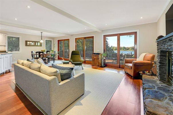 Dining room, Fireplace, Interior, Living room, Pendant Lights, Recessed Lighting, Water, Wood Texture Flooring