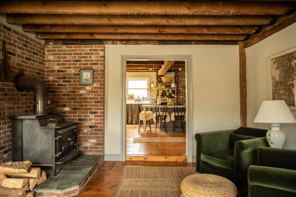 Dining room, Fireplace, Interior, Stone Walls, Wooden Beams, Wood Texture Flooring